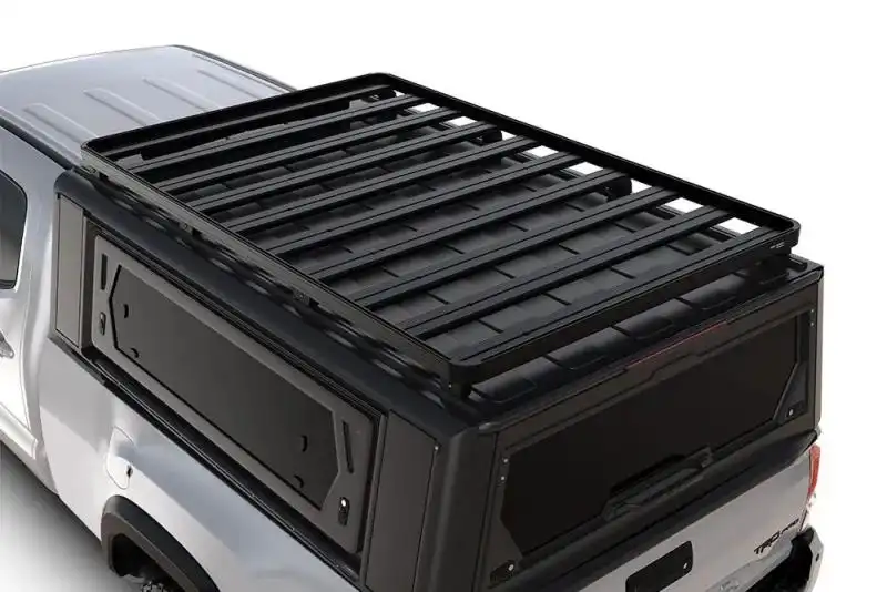 Baca Slimline II para Capota Alu-Cab Toyota Tacoma (2015-2023) Caja de 6 - Asegrate de que la capota Alu-Cab Explorer de tu Toyota Tacoma est preparada para transportar todo tipo de equipo con la baca Slimline II, ligera y personalizable. Con ms de 55 accesorios disponibles para esta baca portaequipajes, transportar cajas de almacenamiento, una tienda de campaa en el techo, bidones, equipamiento deportivo, material de acampada y equipo de trabajo, es fcil.